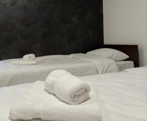 Postel nebo postele na pokoji v ubytování Apartmani Bosfor