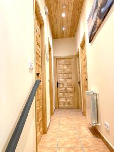 a hallway with a door in a house at LA PORTADA DE ABAJO in Gallegos