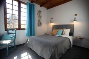 Postel nebo postele na pokoji v ubytování PHOENIX maison d'hôtes & SPA