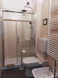 a bathroom with a shower and a toilet and a sink at Riviera Garibaldi in Treviso
