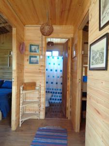 a small room with a bedroom and a bathroom at Cabañas de la Laguna in Parral