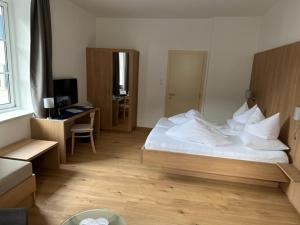 Letto o letti in una camera di Hotel Kendler