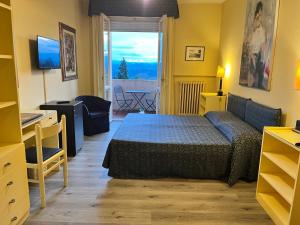 Postel nebo postele na pokoji v ubytování Hotel & Residence Dei Duchi