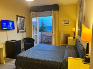 TV a/nebo společenská místnost v ubytování Hotel & Residence Dei Duchi