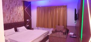 A bed or beds in a room at RBS Hotel & Restaurant 5 mint walking distance from Ram Janam Bhumi