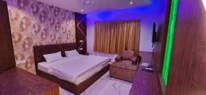 A bed or beds in a room at RBS Hotel & Restaurant 5 mint walking distance from Ram Janam Bhumi