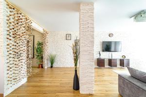 a living room with a white brick wall at Perla de Malagueta in Málaga