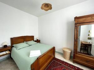 Ένα ή περισσότερα κρεβάτια σε δωμάτιο στο Le Clos du Golfe