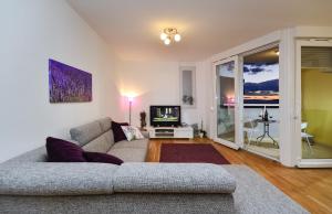 a living room with a couch and a tv at Lavanda in Makarska