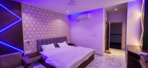 A bed or beds in a room at RBS Hotel & Restaurant 5 mint walking distance from Ram Janam Bhumi