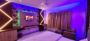 A television and/or entertainment centre at RBS Hotel & Restaurant 5 mint walking distance from Ram Janam Bhumi