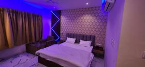 A bed or beds in a room at RBS Hotel & Restaurant 5 mint walking distance from Ram Janam Bhumi