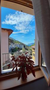 Photo de la galerie de l'établissement GARDA BALDO APARTMENTS_VIVALDI, à Nago-Torbole