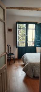 A bed or beds in a room at El Volante Alojamiento Turístico