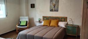 A bed or beds in a room at El Volante Alojamiento Turístico