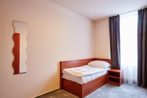 Posteľ alebo postele v izbe v ubytovaní Hotel Terasa