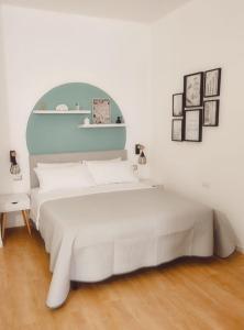 Ліжко або ліжка в номері La Dimora di Lexy