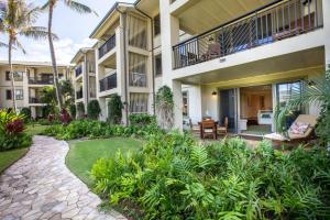 a courtyard of a building with a patio at Glorious Beachfront high end Villa in Kahuku