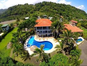 an aerial view of a house with a swimming pool at Hermosa Beach House in Playa Hermosa