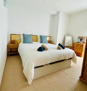 Postel nebo postele na pokoji v ubytování Atico & Terraza by Maison Jaken