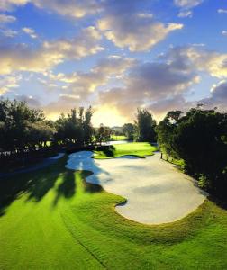 an aerial view of a golf course with a river at Americas Best Value Inn Bradenton-Sarasota in Bradenton