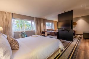 Ένα ή περισσότερα κρεβάτια σε δωμάτιο στο Movich Hotel Las Lomas