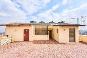 a house on a roof with a brick driveway at City view luxury Suites in Nairobi