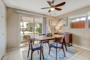 a dining room with a ceiling fan and a table and chairs at Little Beach House w/ POOL&SPA - 5 minutes to Vanderbilt Beach (Pet Friendly) in Naples