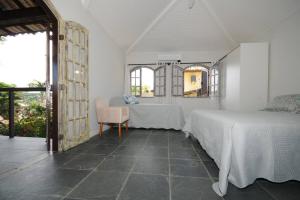 Ein Bett oder Betten in einem Zimmer der Unterkunft Mi casa Búzios
