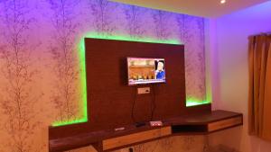 A television and/or entertainment centre at RBS Hotel & Restaurant 5 mint walking distance from Ram Janam Bhumi