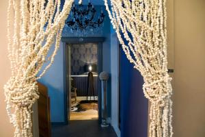 a hallway with a curtain made out of pearls at CasaDodici Boutique Hotel in Cesenatico