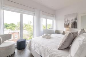 Cama ou camas em um quarto em Parc Avenue Residences Mile End