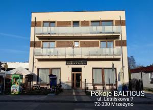 a building with a balcony on the side of it at BALTICUS Mrzeżyno in Mrzeżyno