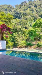 a view of a swimming pool from a house at Hotel Azul Esmeralda in Teapa