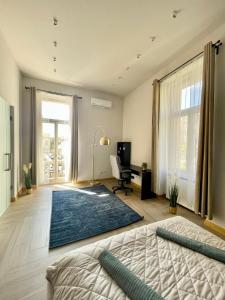 a bedroom with a bed and a desk in a room at Comfort Lux Design Apartment #Castle #2bedroom #freeparking in Budapest
