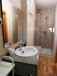 Koupelna v ubytování Hotel Alma Rosa