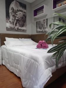 Voodi või voodid majutusasutuse APTO COM VARANDA - 5KM DO AEROPORTO BSB - Nucleo Bandeirante toas