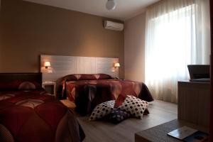Postel nebo postele na pokoji v ubytování Albergo Valentina