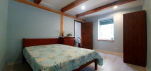Postel nebo postele na pokoji v ubytování ApartmentApsuciems