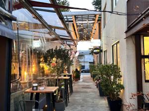 a patio with tables and chairs in a building at Apart Hotel Castellon 176 in Concepción +157 photos