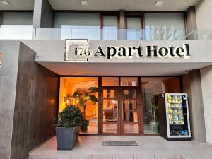 a parrot hotel sign on the front of a building at Apart Hotel Castellon 176 in Concepción