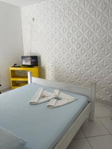 a hospital bed with two utensils sitting on it at Pousada Canto Juquehy in Juquei