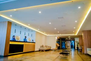 a lobby of a hotel with a reception desk at Aram Beach Boa Viagem in Recife