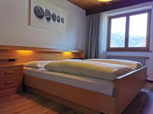 Postel nebo postele na pokoji v ubytování Apartments Steger Sand in Taufers Campo Tures