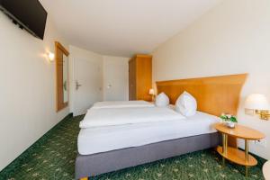 Postel nebo postele na pokoji v ubytování Hotel Leuchtfeuer