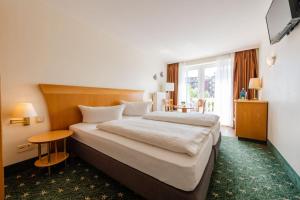 Postel nebo postele na pokoji v ubytování Hotel Leuchtfeuer