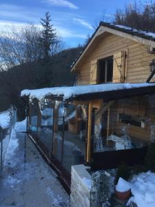 a house with snow on the roof of it at Chalet Alpin suisse in Veysonnaz