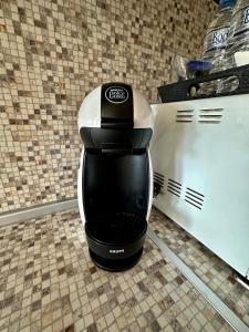 a black and white coffee maker sitting on a counter at The View in Sandanski