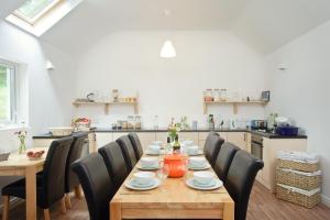 a dining room with a table and chairs at Portsalon Luxury Camping in Portsalon