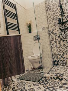 a bathroom with a shower with a toilet in it at SZONDI Heroes Square in Budapest